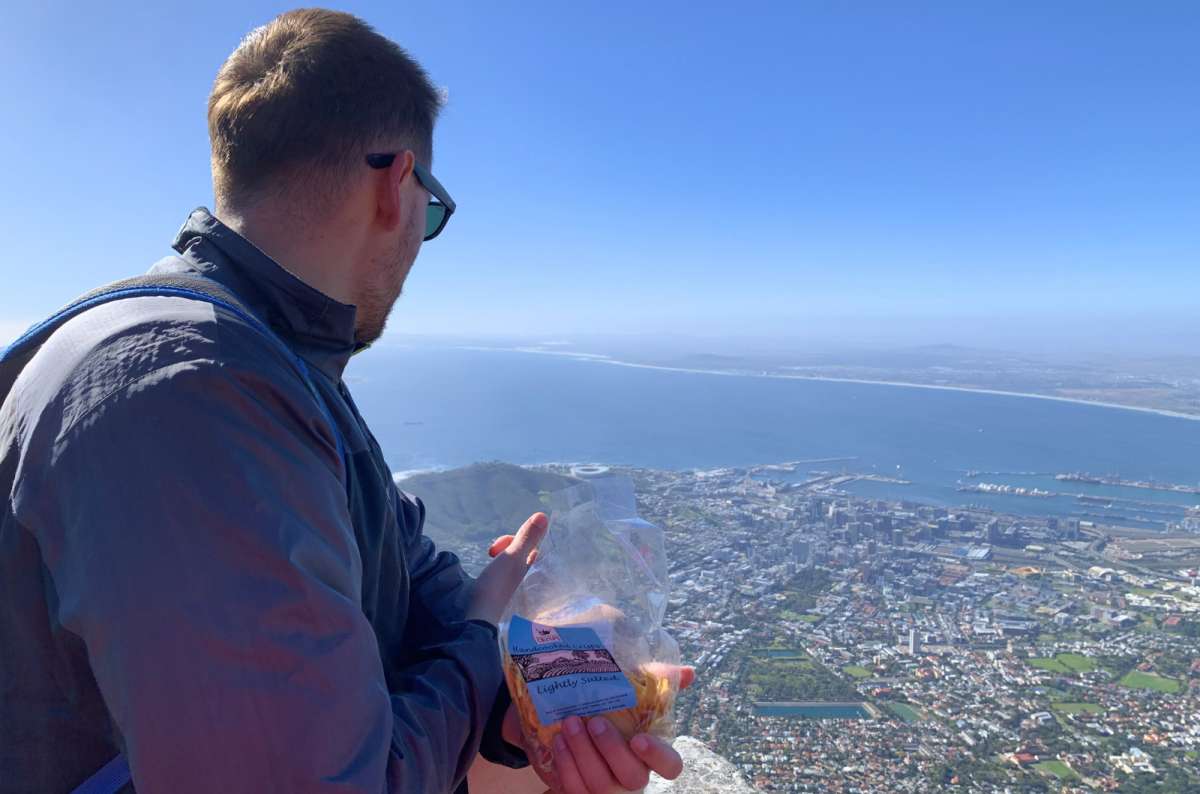 View from Table Mountain over Cape Town, South Africa, with city, coastline, and harbor seen from above, photo by Next Level of Travel