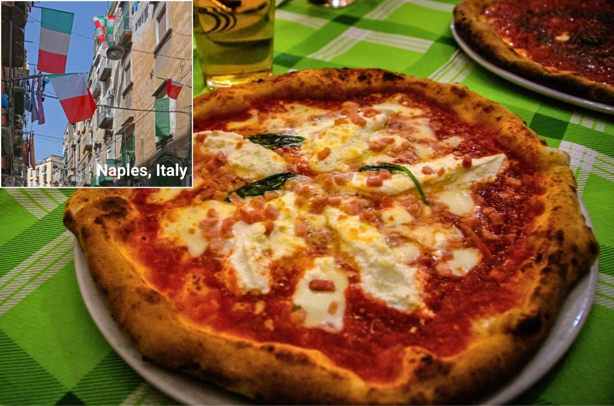 A pizza on the table in a restaurant in Naples, food in Italy
