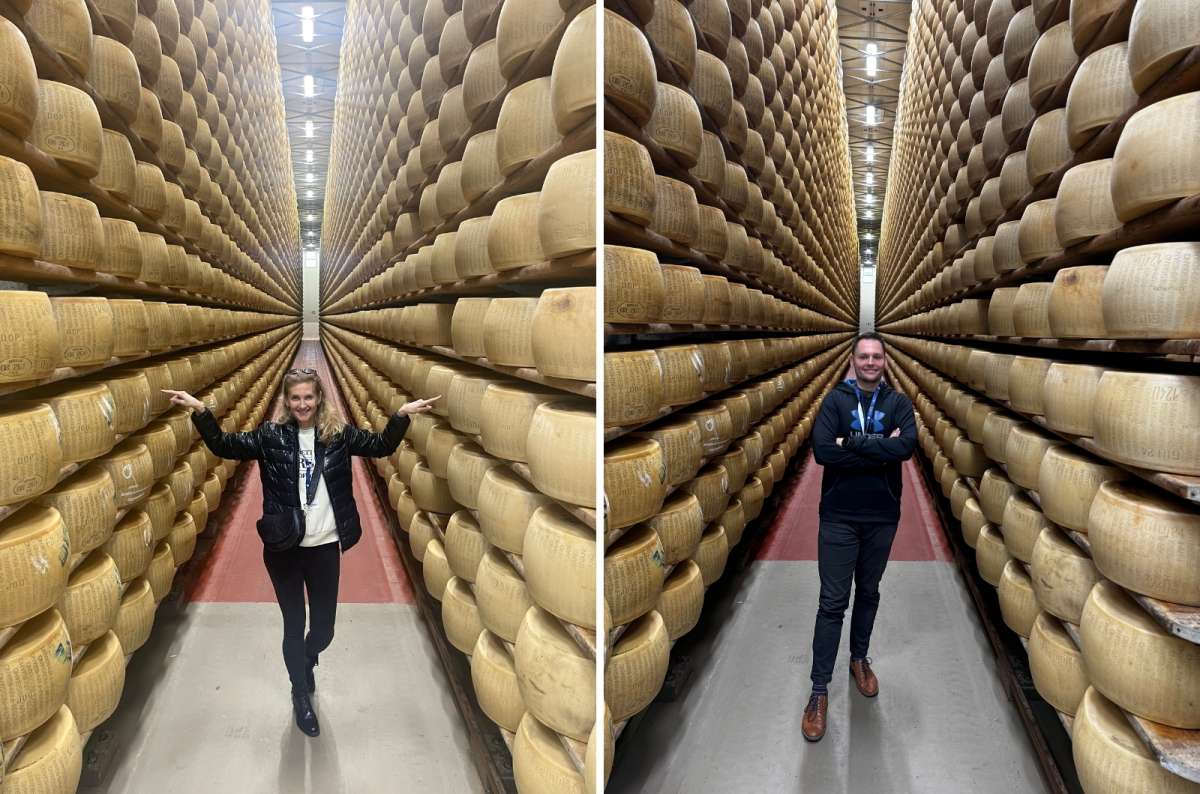 Tourists taking a photo in an alley full of Parmesan cheese in Modena, Italy. Photo by Next Level of Travel