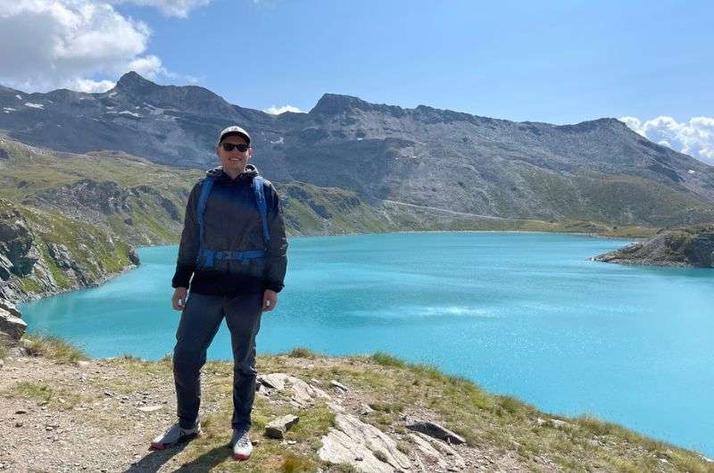 A tourist at the Lago del Goillet/Luc de Goillet, Cervinia in Italy