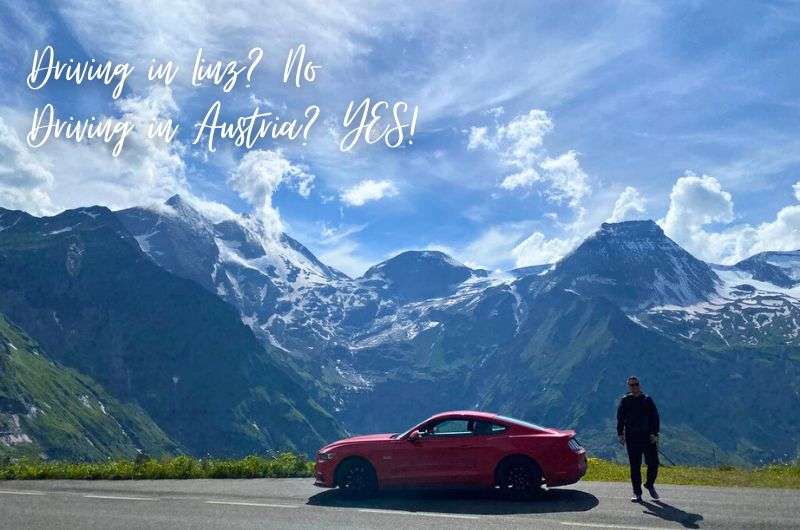 A tourist and his car on an alpine road with mountain views, Austria, photo by Next Level of Travel