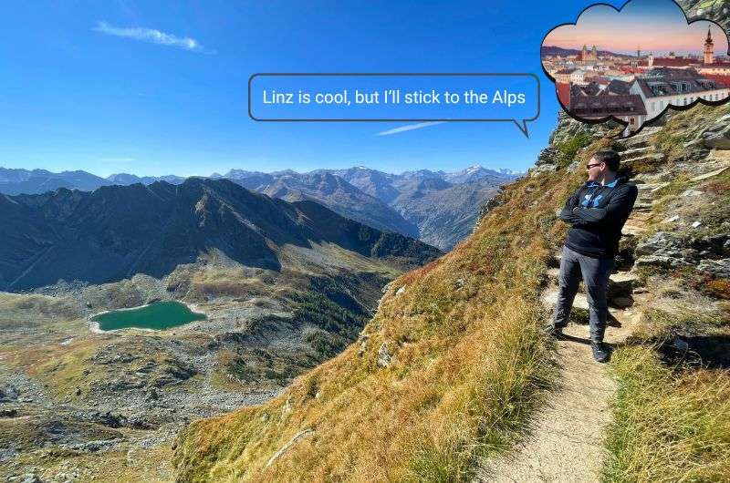 Tourist hiking in Austrian Alps, taking in the views, photo by Next Level of Travel