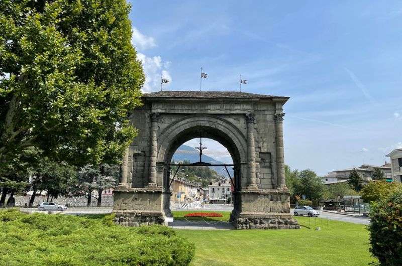 A sunny day view of the Arco de Augusto de Aosta, Italy, photo by Next Level of Travel