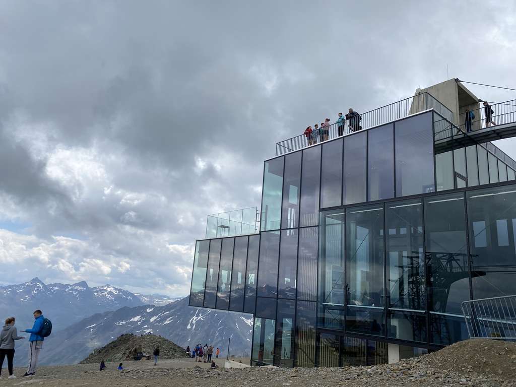 A modern glass building at the 007 Elements museum in Sölden, Austria, perched high in the Alps with panoramic mountain views photo by Next level of travel