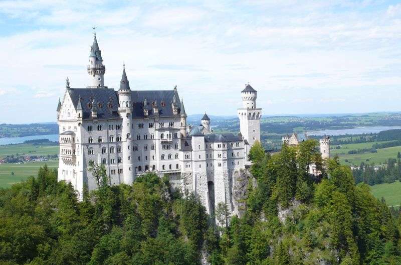 Neuschwanstein Castle perched on a forested hill, Germany
