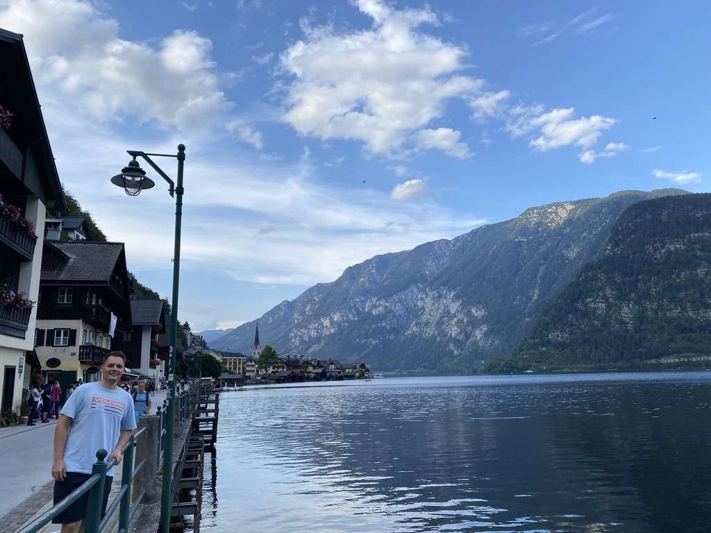Tourist at the lake in the city Hallstatt, Austria, photo by Next level of travel