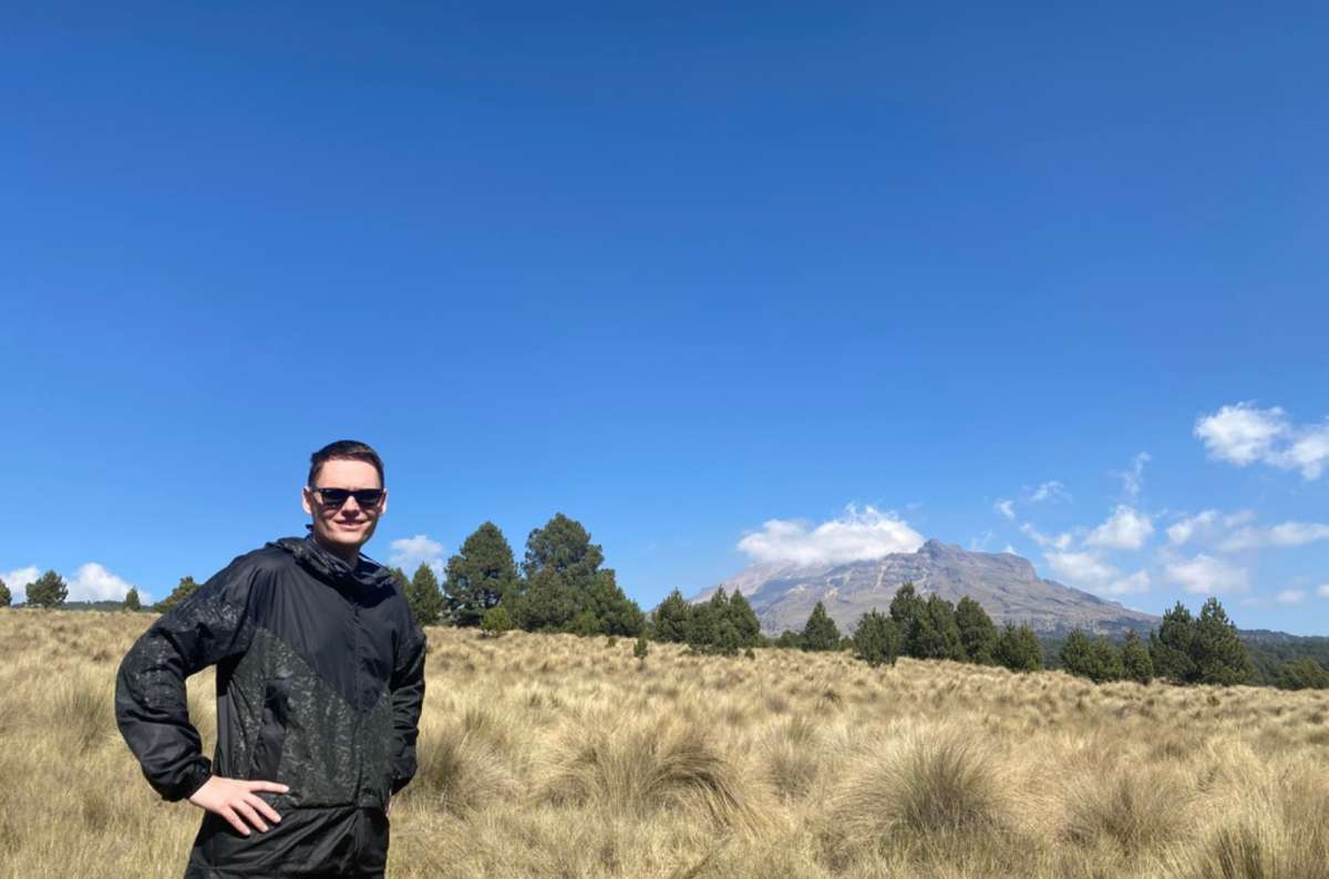 a tourist posing on a plane on the Popopcatelpetl Paso Cortez trail, Mexico, photo by Next Level of Travel