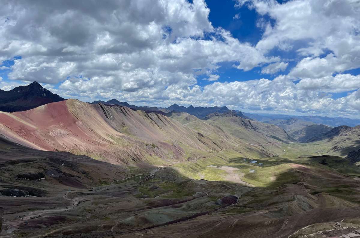 a photo of the panorama of Rainbow mountain, showing its various colours, Peru, photo by Next Level of Travel