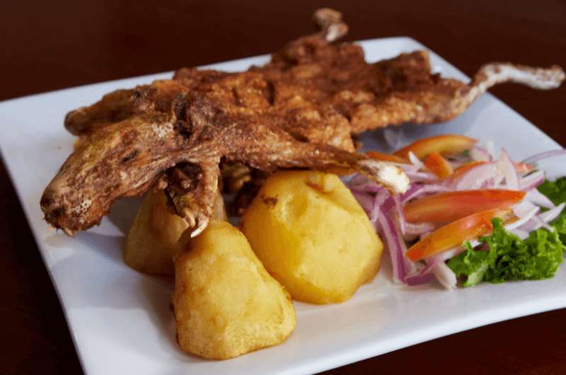 Eating guinea pig in Peru