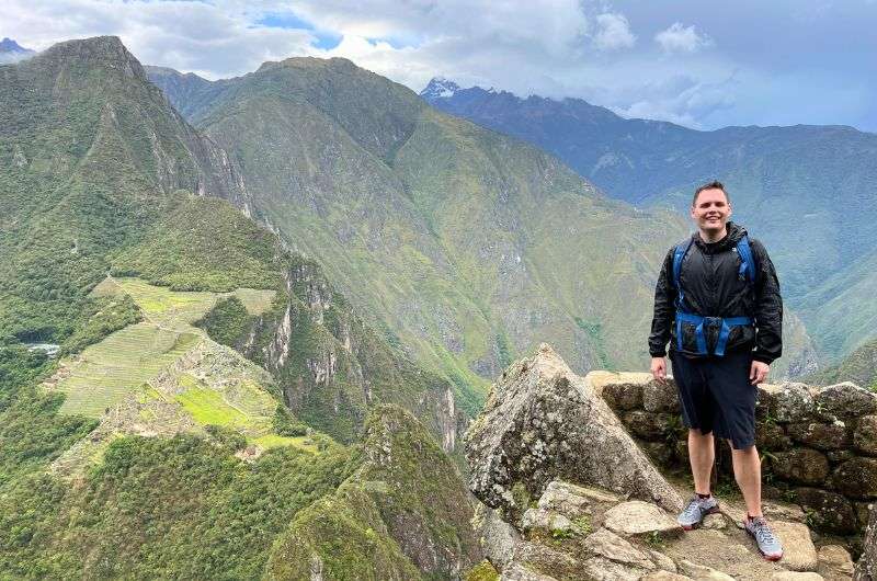 traveler visiting Machu Picchu in Peru, photo by next level of travel
