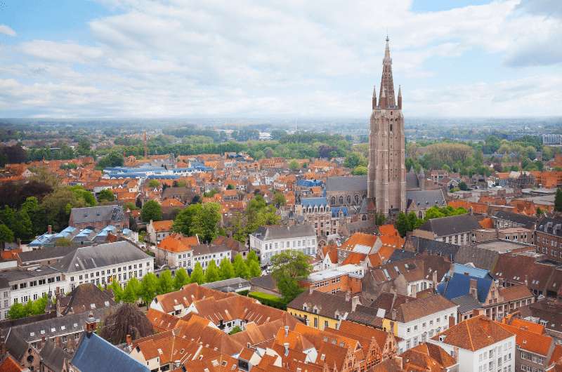 The Church of Our Lady Bruges with tower way above the other buildings of Bruges