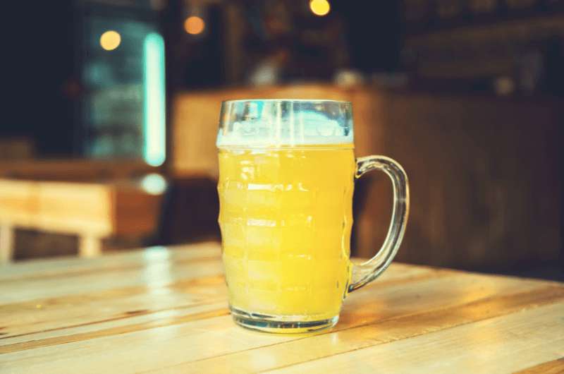 A glass of wheat bear on a Belgian restaurant table