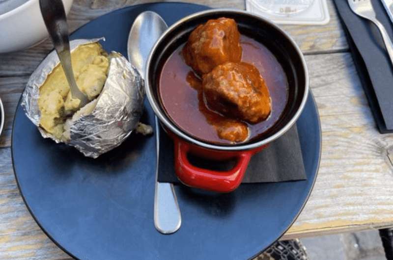 Belgian meatballs with tomato sauce and a potato in Belgium