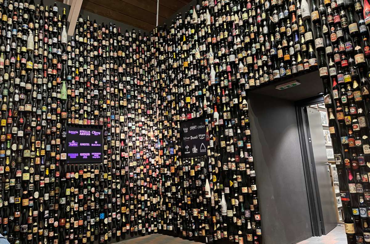 Wall display of hundreds of Belgian beer bottles at the Belgian Brewers Museum in Brussels, showcasing the country’s rich beer heritage, photo by Next Level of Travel