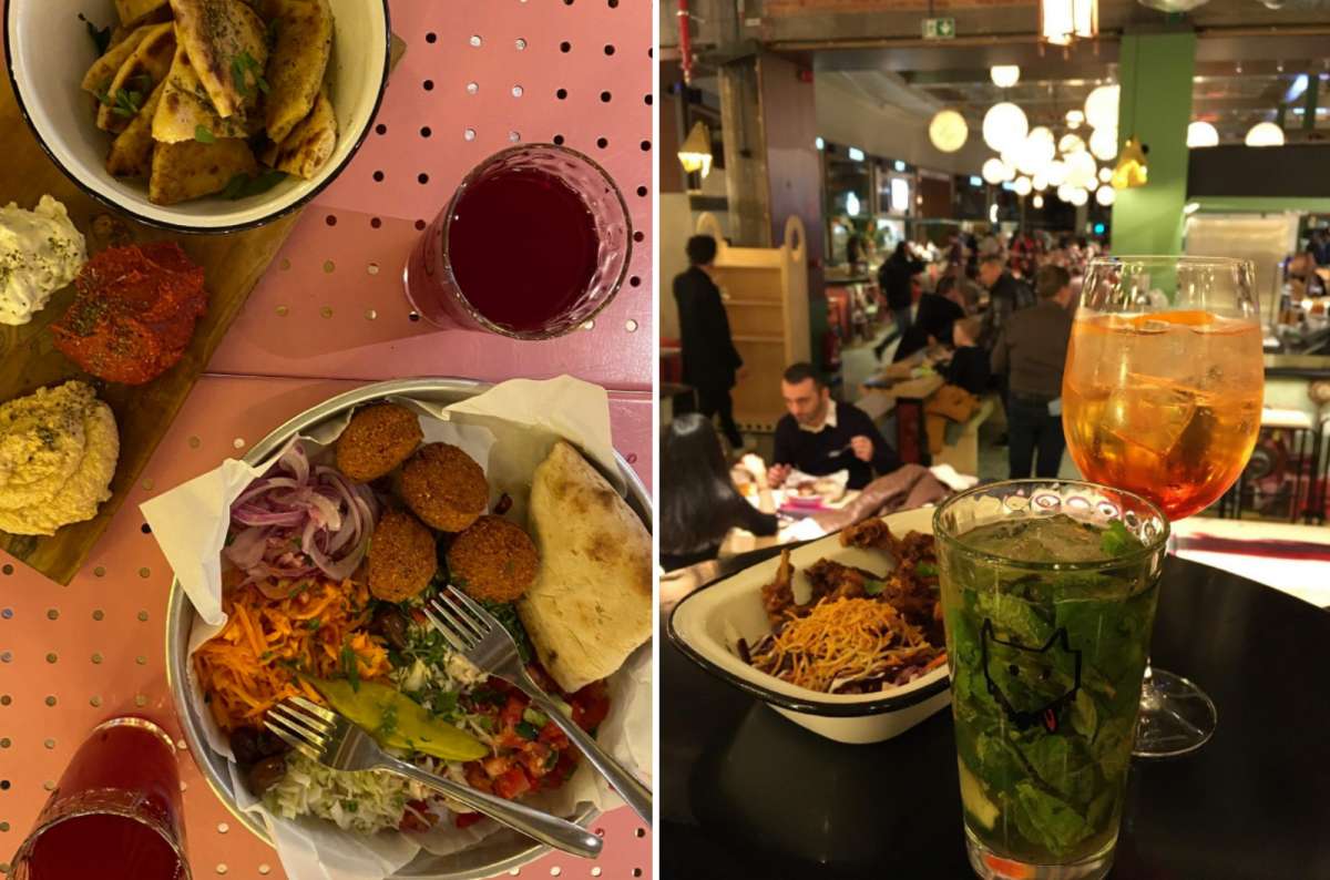 Colorful dishes and cocktails at Wolf Food Market in Brussels, Belgium, featuring falafel plates, dips, and vibrant drinks in a lively food hall setting