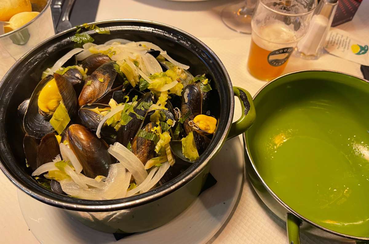 Traditional pot of moules-frites (mussels with onions and herbs) served at Le Rendez-Vous des Artistes in Brussels, Belgium, photo by Next Level of Travel