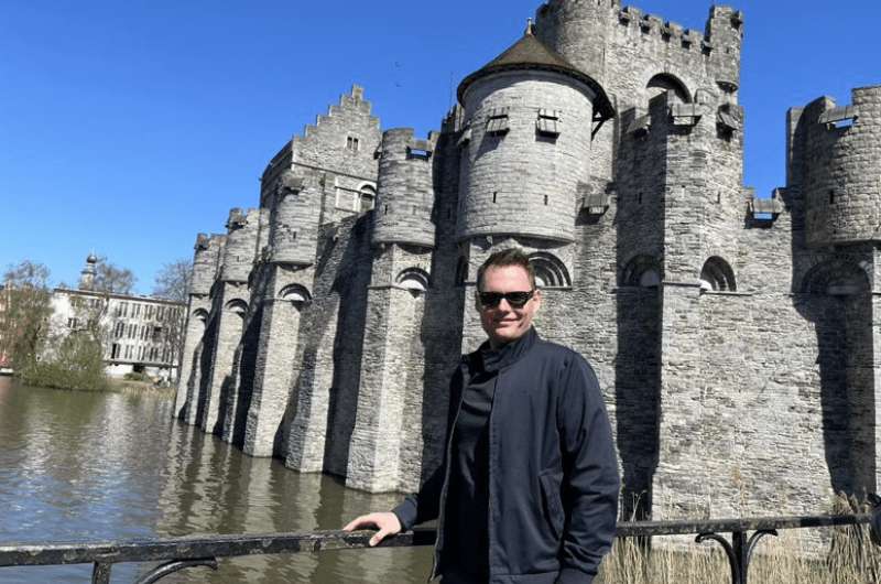 A tourist at the Gravensteen Castle in Ghent in Belgium 