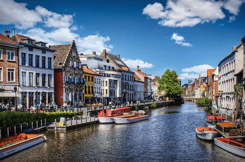 A canal in Ghent, Belgium, surrounded by colorful buildings