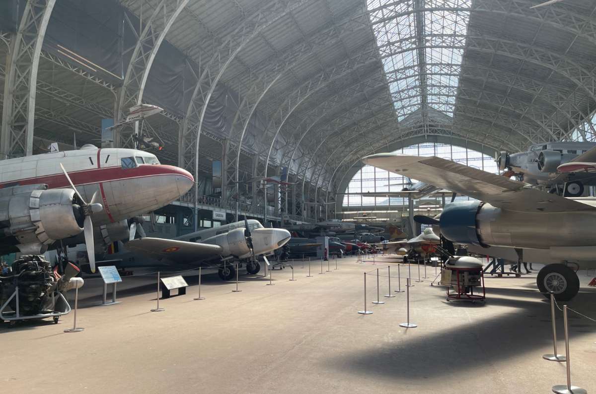 A photo from inside of the Armed Forces museum with many planes in sight, Brussels, Belgium, photo by Next Level of Travel