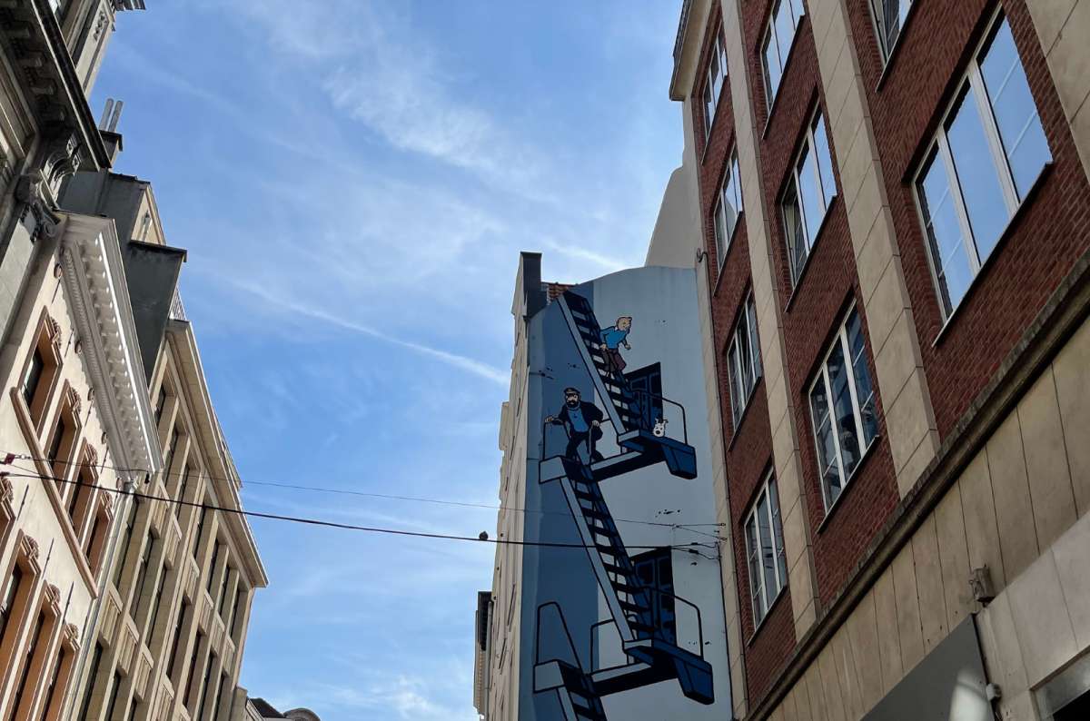 a photo of the Tintin mural on a building in Brussels, Belgium, photo by Next Level of Travel