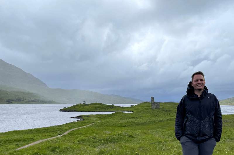 A tourist in Ardvreck Castle, Scotland