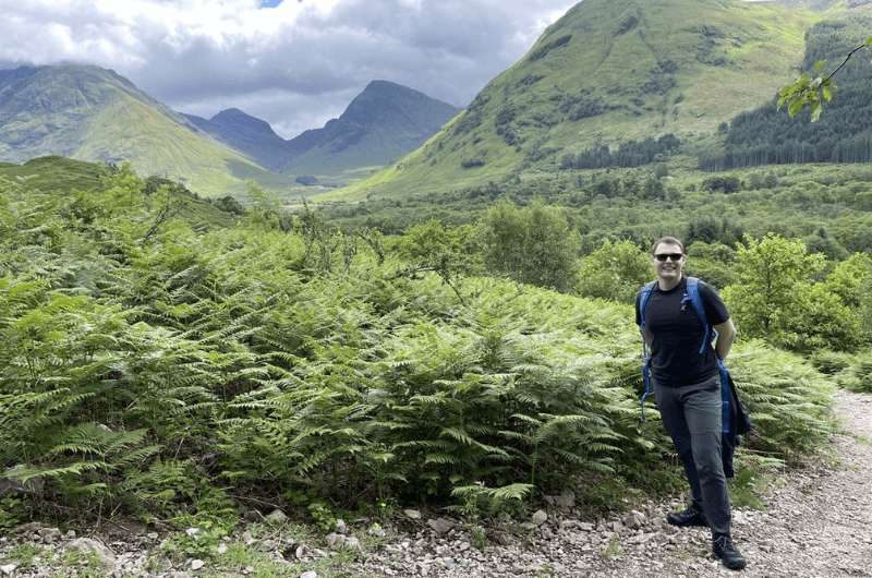A tourist on the Pap of Glencoe hike, Scotland