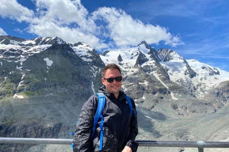 traveler standing by the railing on the Top of Salzburg, Kitzsteinhorn,  Austria itinerary, photo by Next level of travel