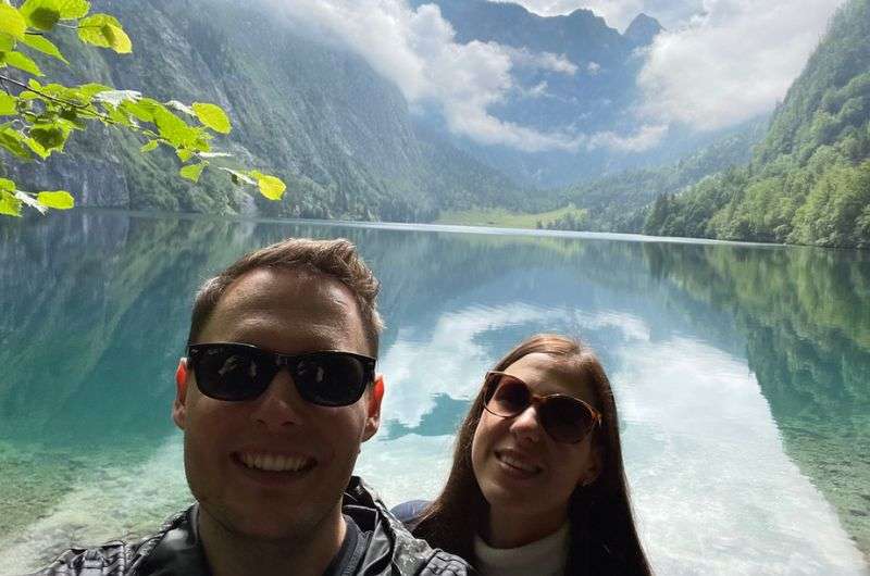 Tourist taking photo with Königssee