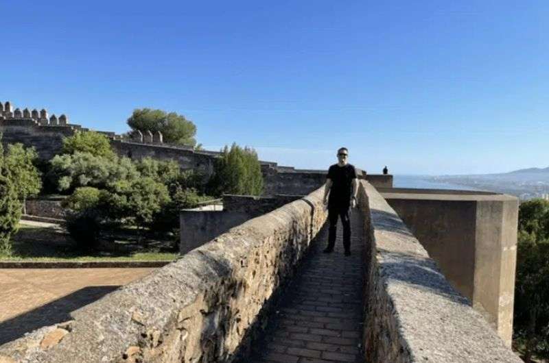 A tourist in Castillo de Gibralfaro—Andalusia itinerary  