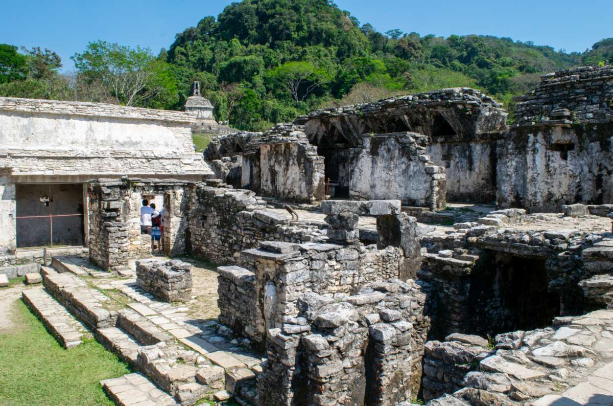ancient Mayan ruins in Palenque, one of the stops in this 2-week Yucatan itinerary,  and a few tourists in the background, Yucatán, Mexico