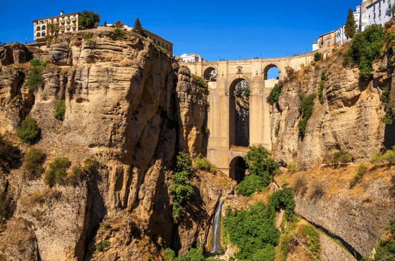 View of New Bridge in Ronda from a viewpoint in the gorge—2-weeks Spain itinerary   