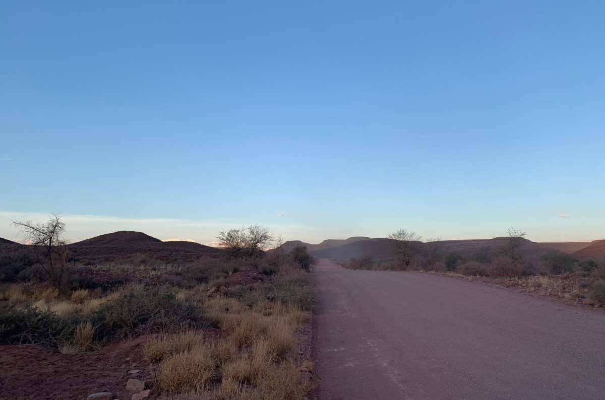 a photo of the road near Sossusvlei during the sunrise, Namibia, photo by Next Level of Travel