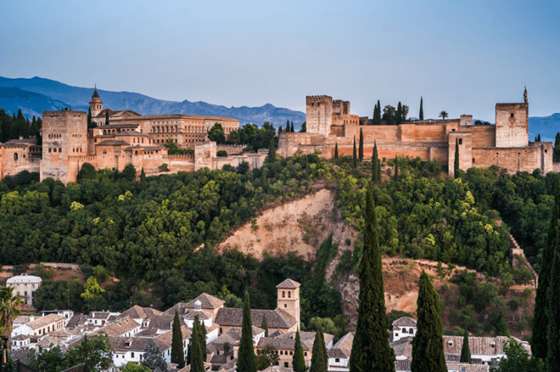 The view of the Alhambra from the Albaicin neighborhood at sunset
