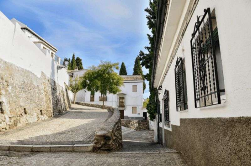 The white houses and narrow stone alleys of Granada’s Albaicin neighborhood