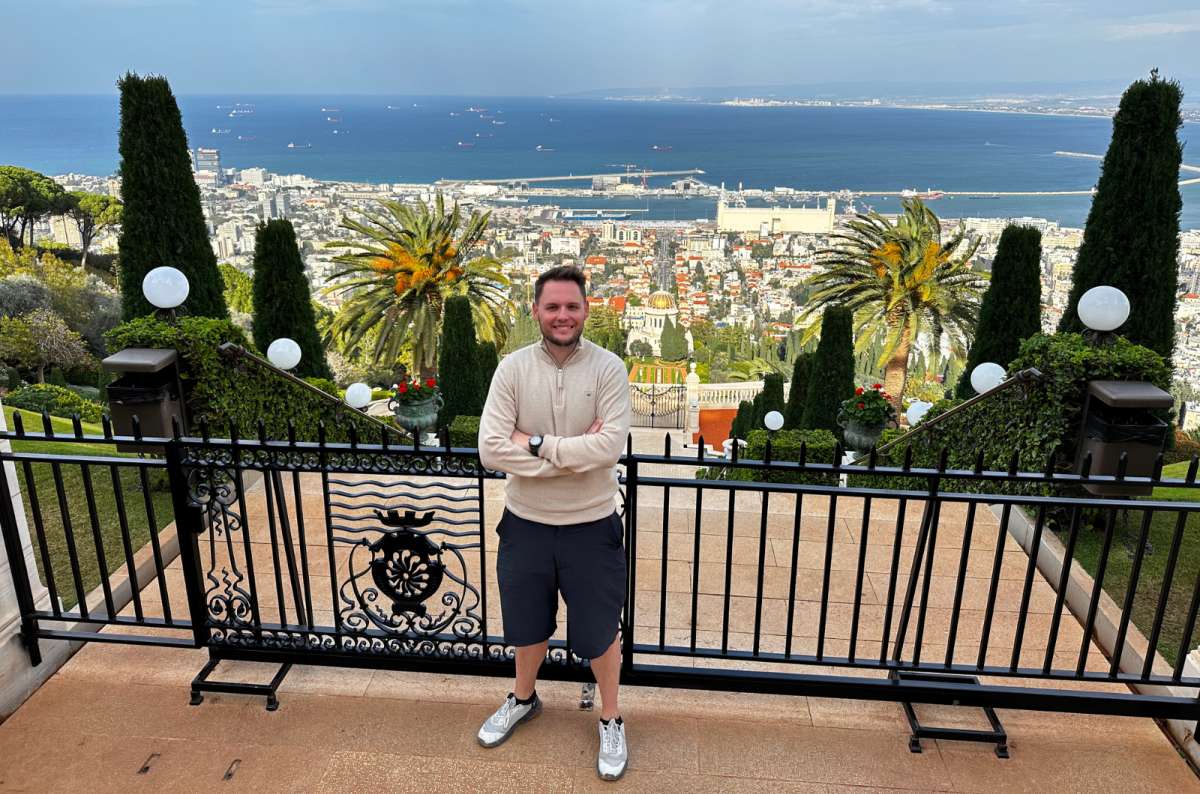 a photo of a tourist posing at the Bahai Gardens, Israel, photo by Next Level of Travel