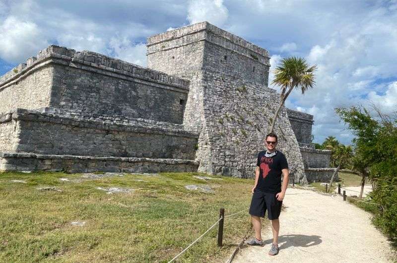 A tourist visiting the ruins in Tulum, Mexico