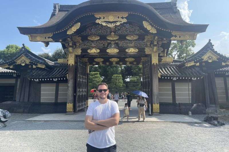 Standing in front of the gates at Kyoto Nijō Castle, Japan