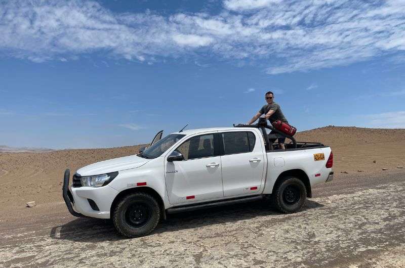 Driving a car in Paracas National Reserve in Peru