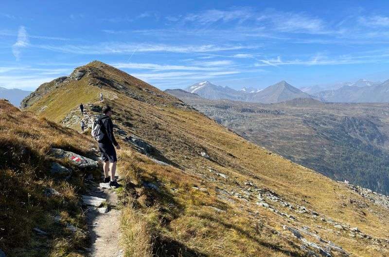 Tourist on the Stubnerkogel hiking trail near Bad Gastein, Austria, photo by Next Level of Travel