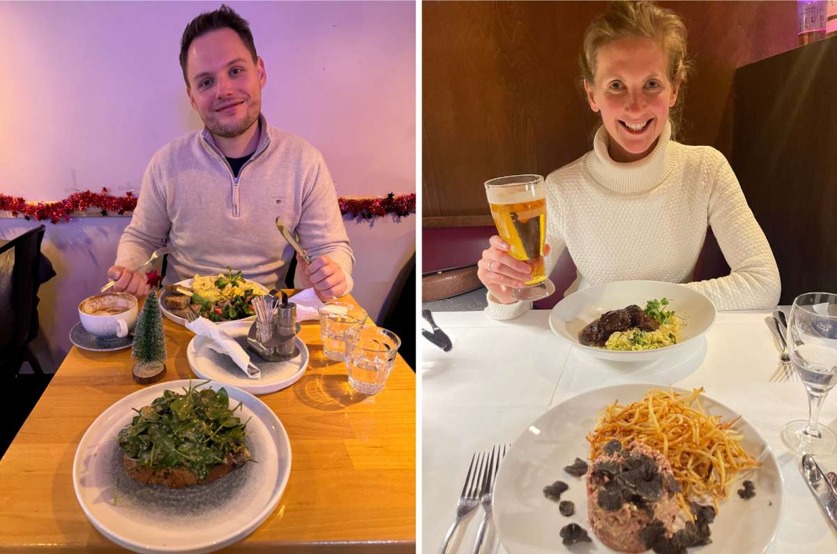Two people enjoying dinner at a restaurant with full plates in front of them in Berlin, Germany, photo by Next Level of Travel