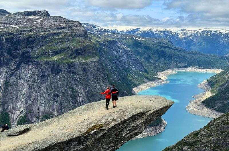 Travelers on Trolltunga in Norway, photo by Next Level of Travel
