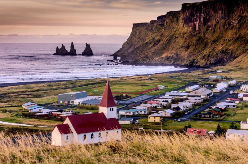 Church, town of Vik, and beach in Iceland