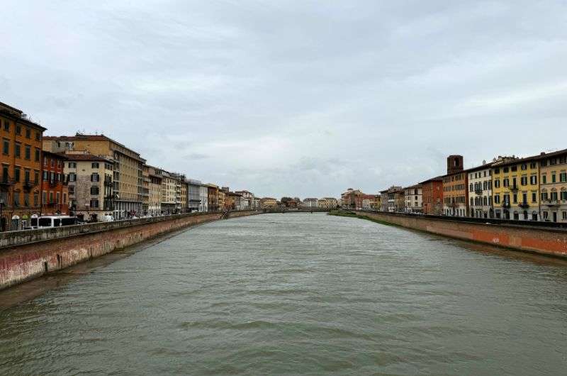 View of the Arno River in Pisa, Italy, photo by Next level of travel