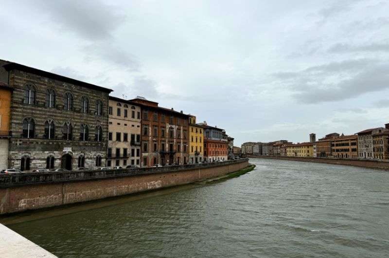 View of the Arno River in Pisa, Italy, photo by Next level of travel