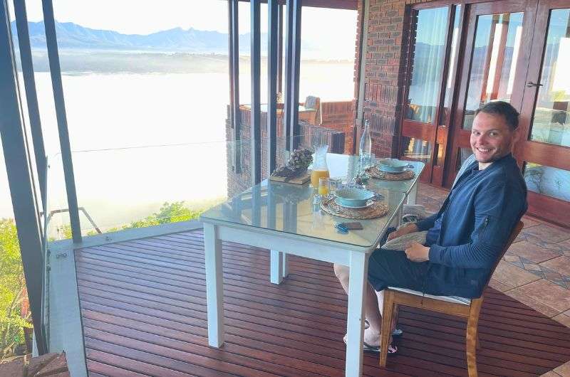 Man sitting at the private dining table on the hotel balcony, Kambaku @ Sea Hotel, Garden Route, photo by Next level of travel