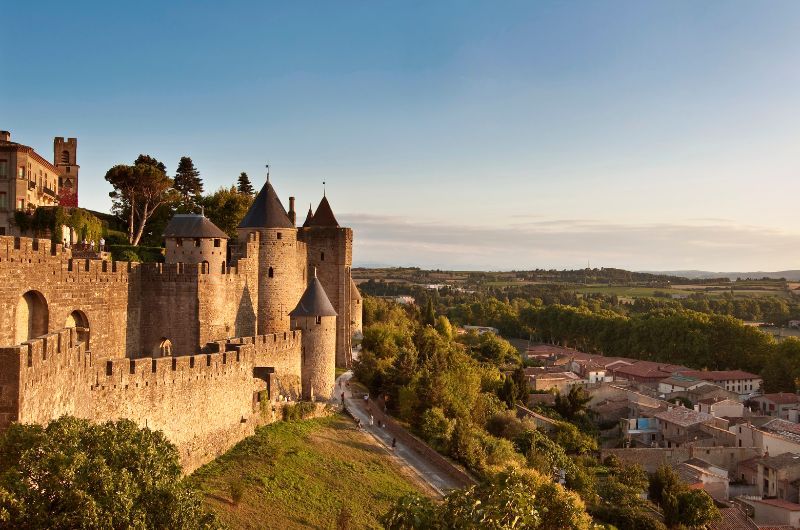 Carcassonne Castle with view over the landscape, France, during sunset
