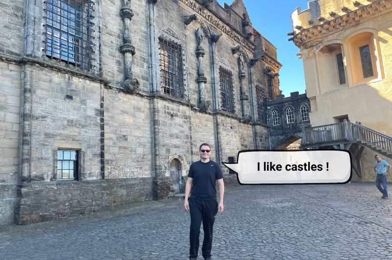 Man in the courtyard of the Stirling Castle, Scotland, photo by Next level of travel