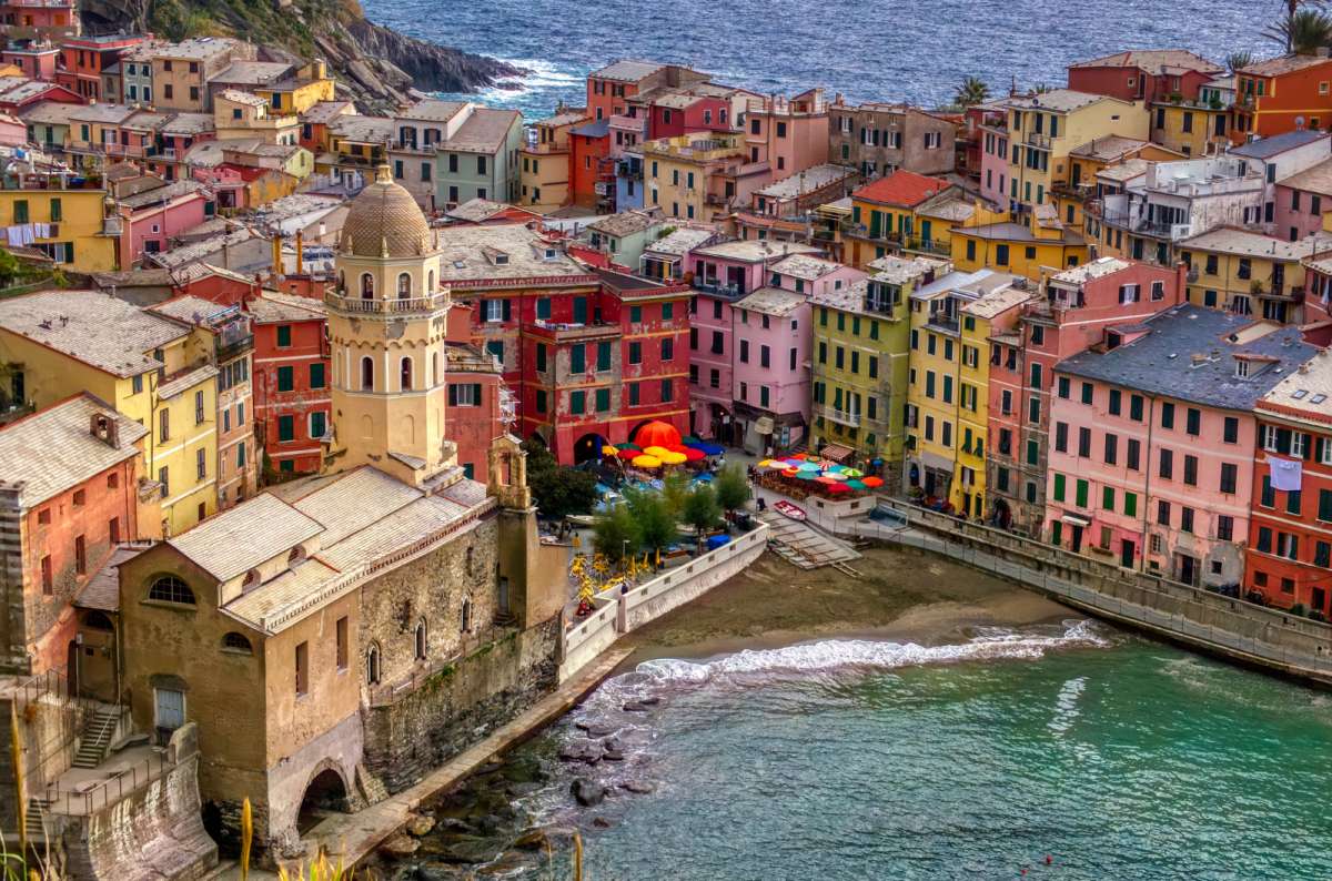 A view of Vernazza, Cinque Terre, Italy, featuring colorful seaside houses