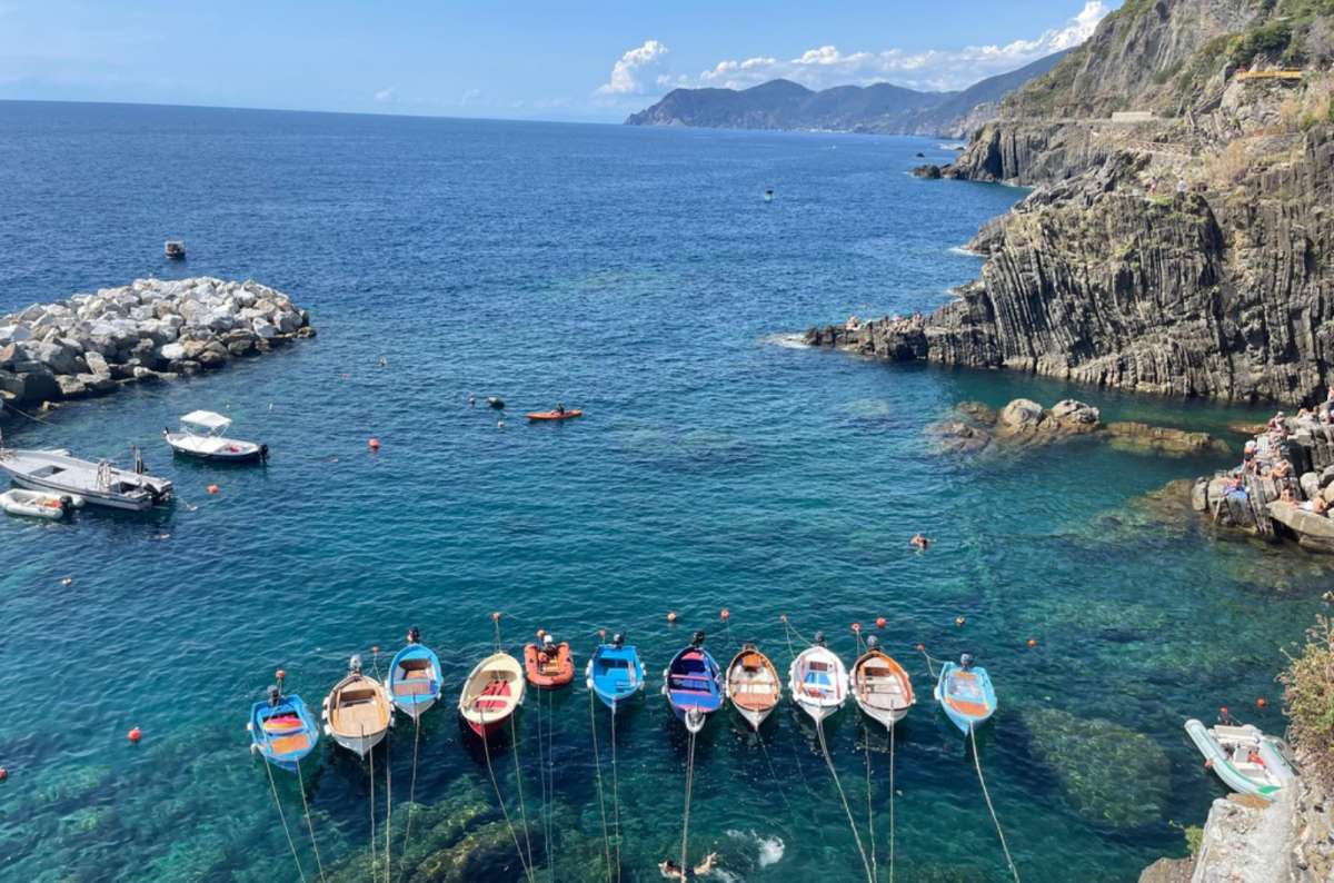 Small fishing boats in Riomaggiore, Cinque Terre, Italy, photo by next level of travel