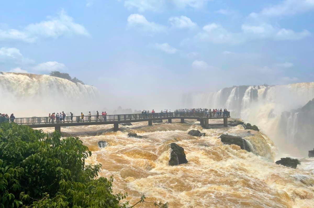 Tourists on long walkway close up to Iguazu Falls, Argentina, photo by Next Level of Travel